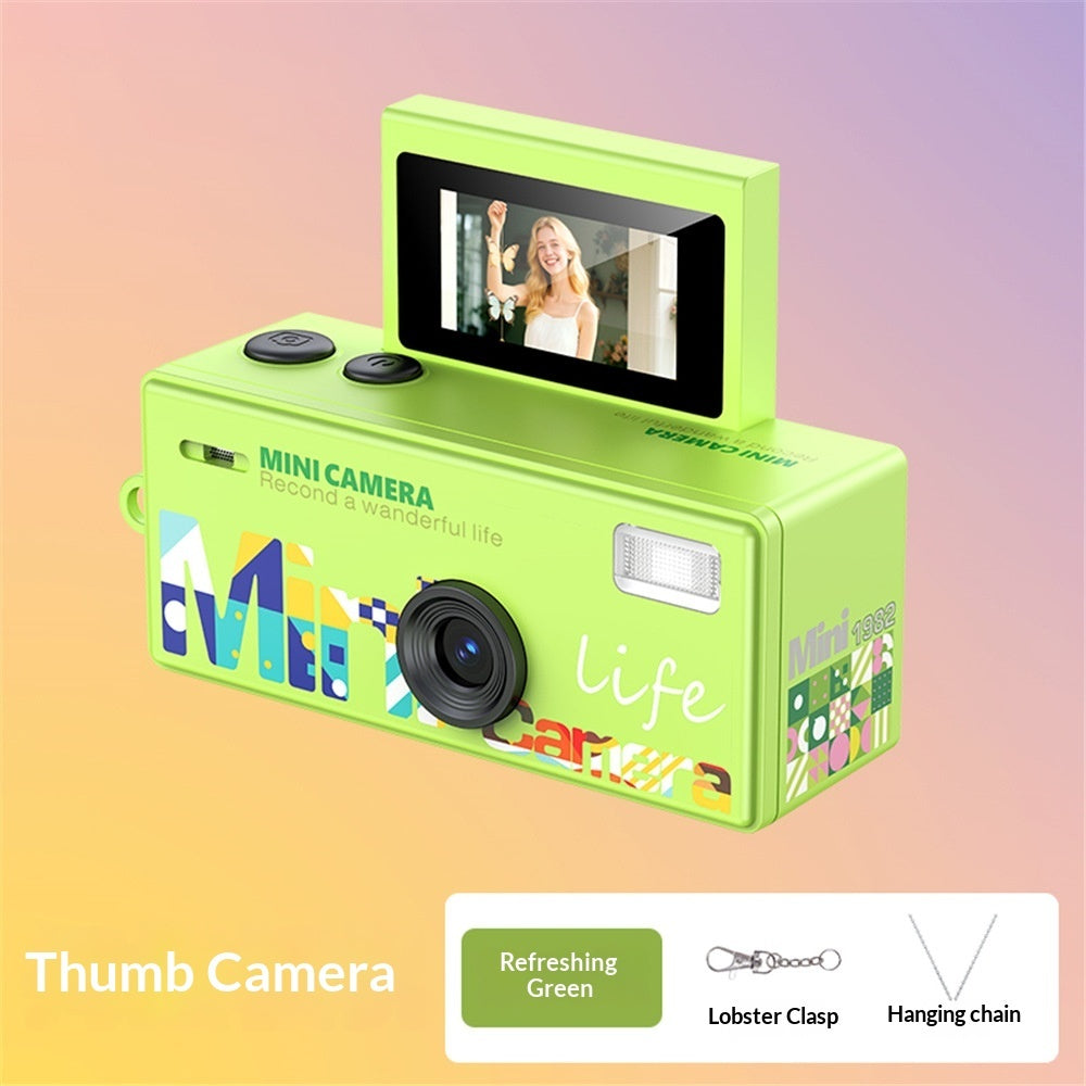 Green instant camera with colorful design on a gradient background