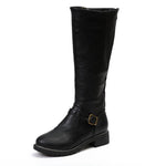 Black knee-high boot with a buckle on a white background