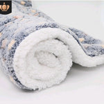 Rolled-up fleece blanket with a soft texture on a white background