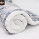 Rolled-up fleece blanket with a soft texture on a white background