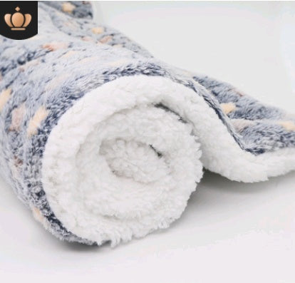 Rolled-up fleece blanket with a soft texture on a white background