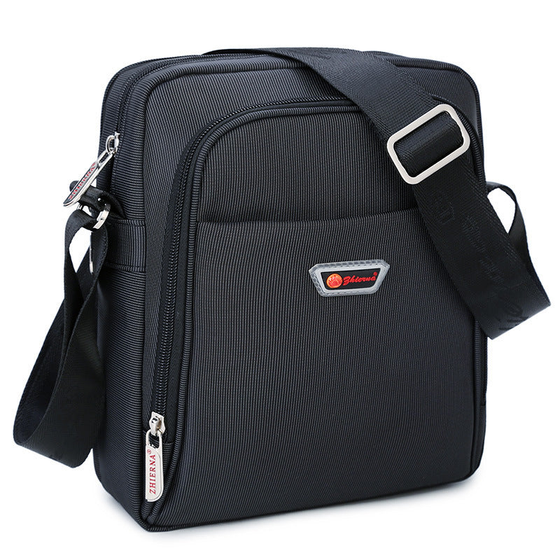 Black shoulder bag with a brand logo on a white background