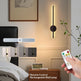 Wall-mounted lamp with remote control in a bedroom setting