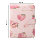 Pink notebook with peach pattern and measurements on a white background
