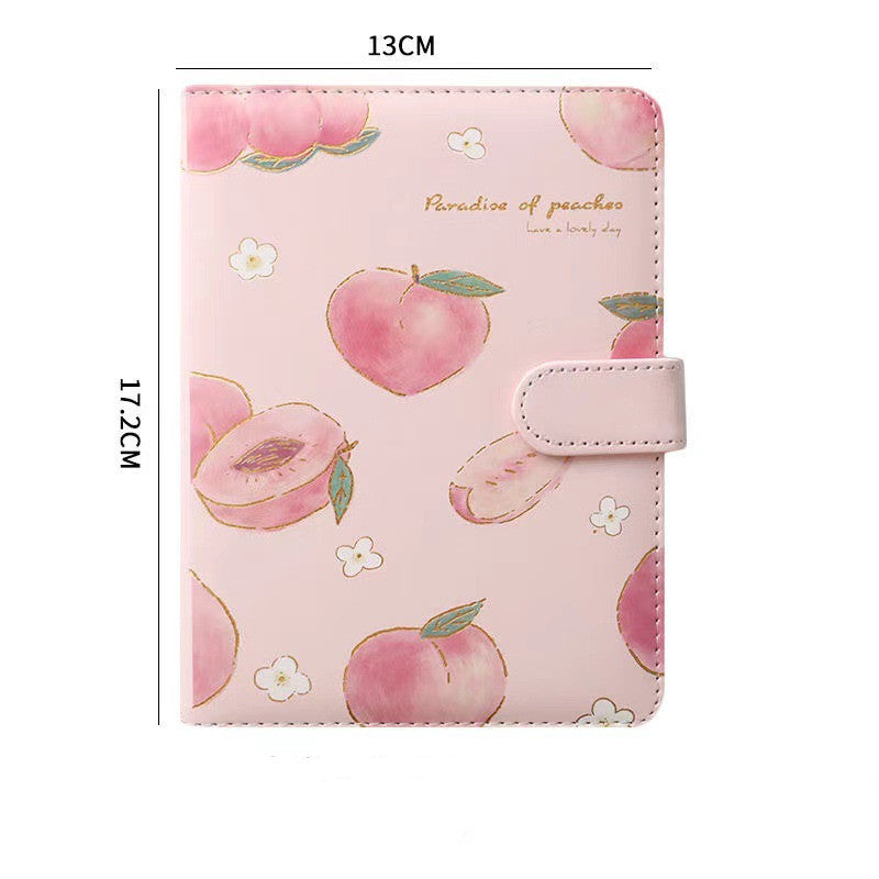 Pink notebook with peach pattern and measurements on a white background