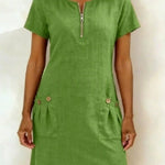 Green dress with a zipper on a white background