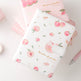 Notebook with peach pattern on a light pink background