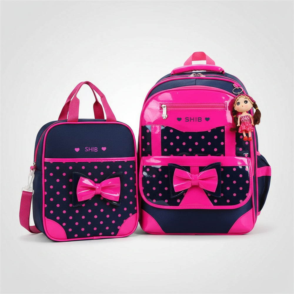 Pink and navy backpack set with polka dots and bows on a white background