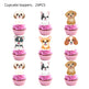Cupcake toppers with dog designs on pink cupcakes against a white background