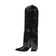 A single black leather knee-high boot with pointed toe, block heel, and silver rhinestone studded details along the lower shaft and toe area, shown against a plain white background.