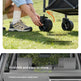 A two-panel product explainer showing how to disassemble and store a folding stroller/waggon. The top panel shows a person outdoors lowering a wheel with text instructions 'Press the button' and 'Pull the wheel downward.