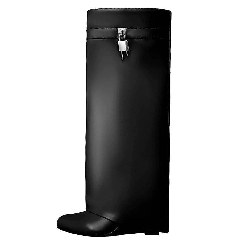 Black rain boot with a silver zipper on a white background