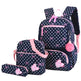 Polka dot backpack set with pink accents on a white background