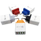 Set of multi-colored travel adapters on a white background