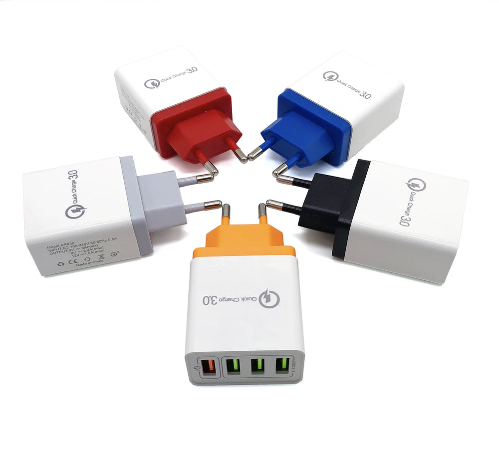Set of multi-colored travel adapters on a white background