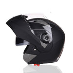 Black motorcycle helmet with clear visor on a white background