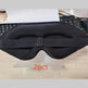 Black eye mask on a stand with '2pcs' text, keyboard in the background