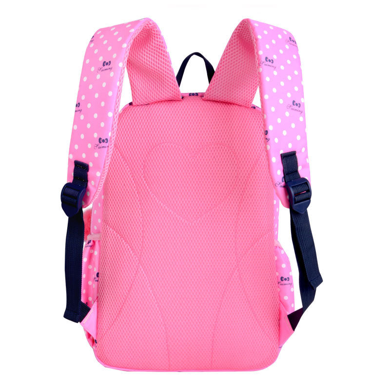 Pink backpack with polka dot straps on a white background