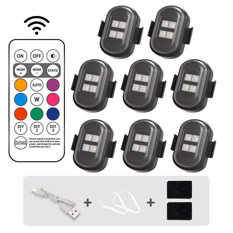 Set of LED lights with remote control and accessories on a white background