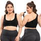 Woman wearing a black sports bra and gray leggings, showing front and back views.
