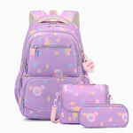 A pastel purple backpack set with matching pouches, featuring a cute cartoon space and animal print. The set includes a large backpack, a small shoulder bag, and a pencil case, all with matching pink straps and a heart-shaped 'Double A Girl' tag.