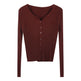 Brown ribbed sweater with buttons on a white background