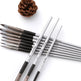 Set of paintbrushes with 'Manly' branding on a white background with a pine cone.