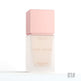 Sunscreen bottle with pink cap and visible brand name on a white background