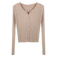 Beige ribbed sweater with buttons on a white background