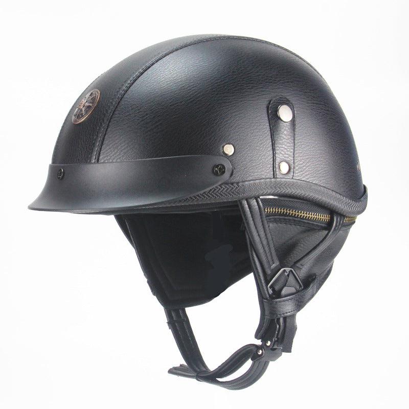 Black leather helmet with chin strap on a white background