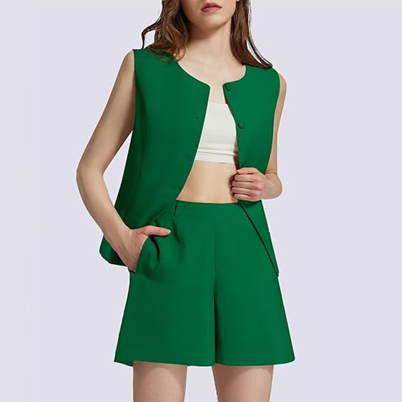 Woman wearing a green vest and shorts set on a light purple background