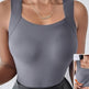 Gray athletic top worn by a person with a close-up inset showing the waist area.