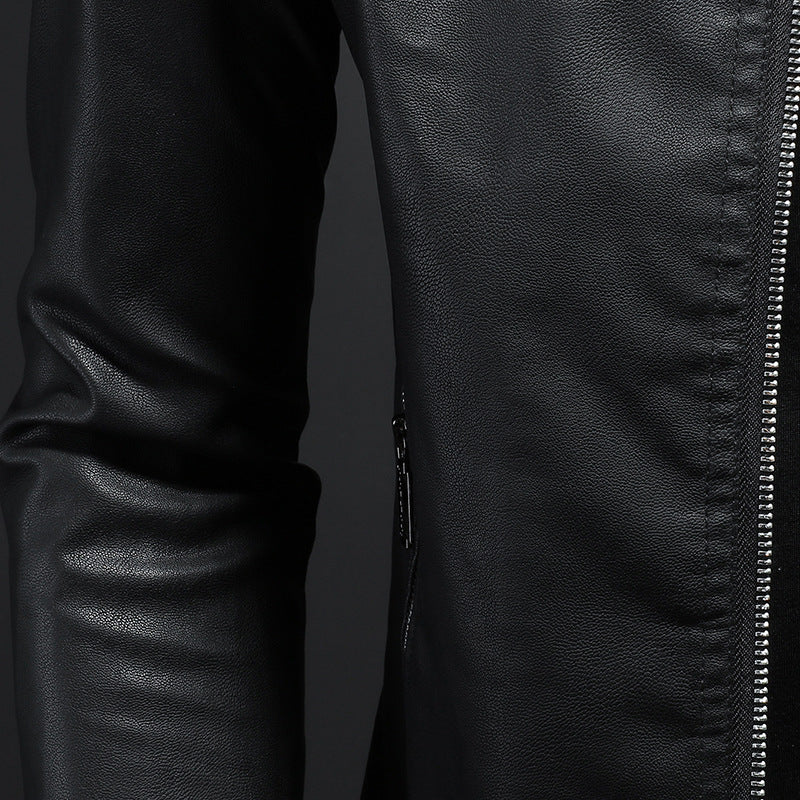 Close-up of a black leather jacket with a zipper on a dark background