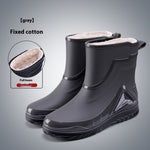 Gray rubber boots with white lining on a gray background