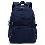 Navy blue backpack with multiple zippers on a white background