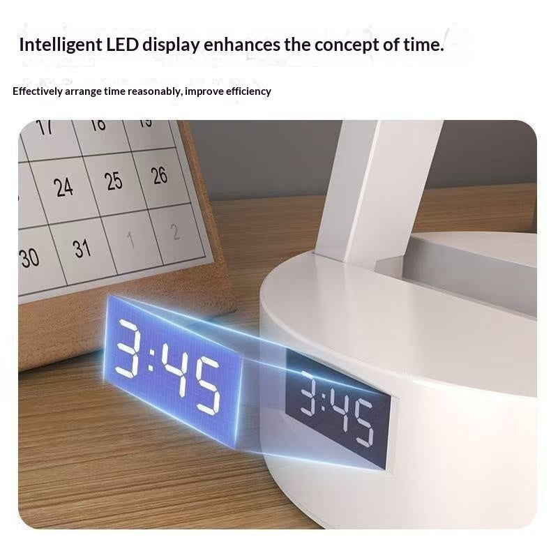 Digital clock with LED display on a desk next to a calendar