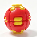 A red and yellow interlocking ball-shaped toy or puzzle, photographed on a clean white background.