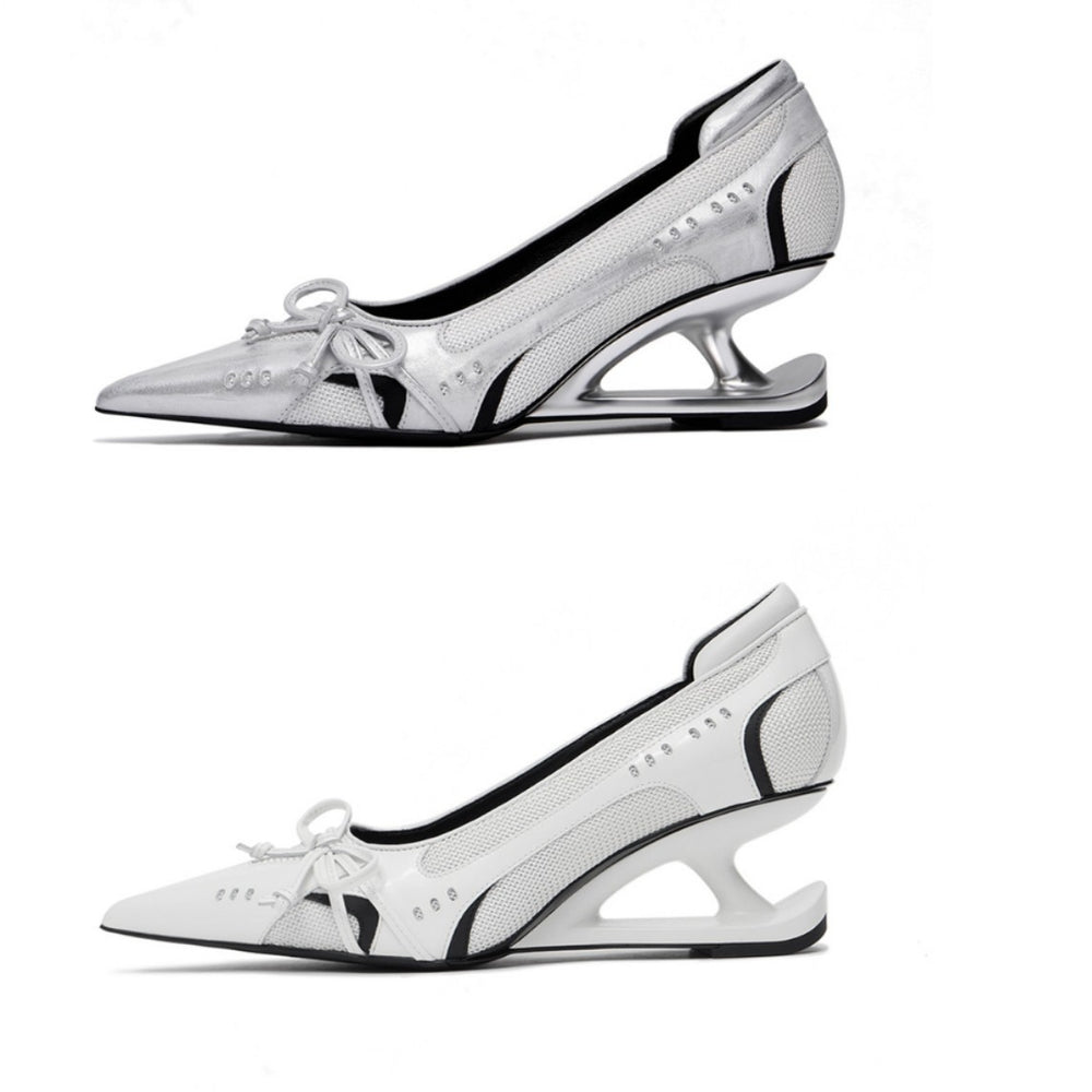 White high-heeled shoes with black accents on a white background