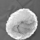 Close-up of a white sherpa fleece-lined cuff on a dark gray garment.