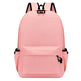 Pink backpack with black straps on a white background