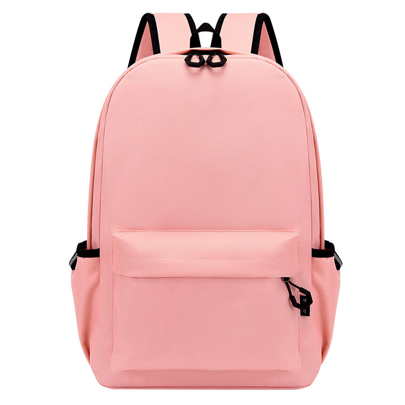 Pink backpack with black straps on a white background