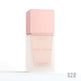 Sunscreen bottle with pink cap and body on a white background