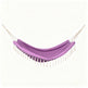 A purple fabric hammock with white rope suspension cords and white tassels, shown against a plain off-white background.