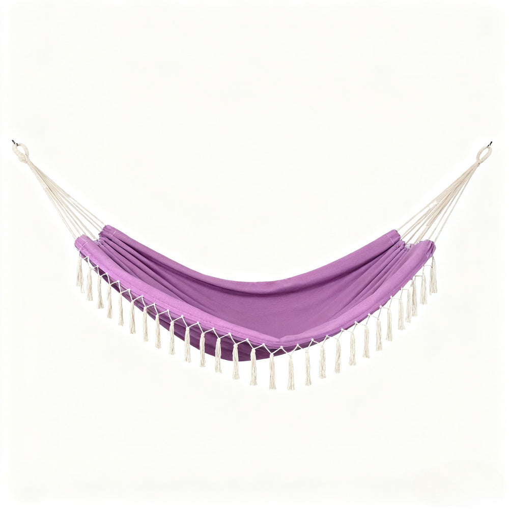 A purple fabric hammock with white rope suspension cords and white tassels, shown against a plain off-white background.