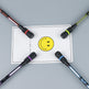 Four fishing rods with colorful handles on a gray surface, with a yellow smiley face card in the center.