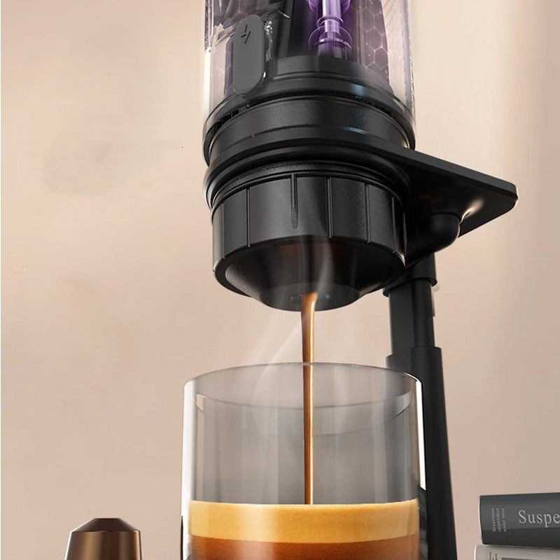 Coffee being poured from a coffee maker into a glass container with a beige background.