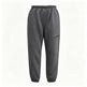 Dark gray jogger-style pants with an elastic waistband, tapered legs, elastic cuffs, and a zippered side pocket, shown against a plain white background.