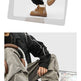 A collage showing two different pairs of chunky lace-up boots worn by a model. The top photo shows tan boots with a brown plaid shirt and black pants.