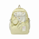 Light yellow backpack with star designs on a white background