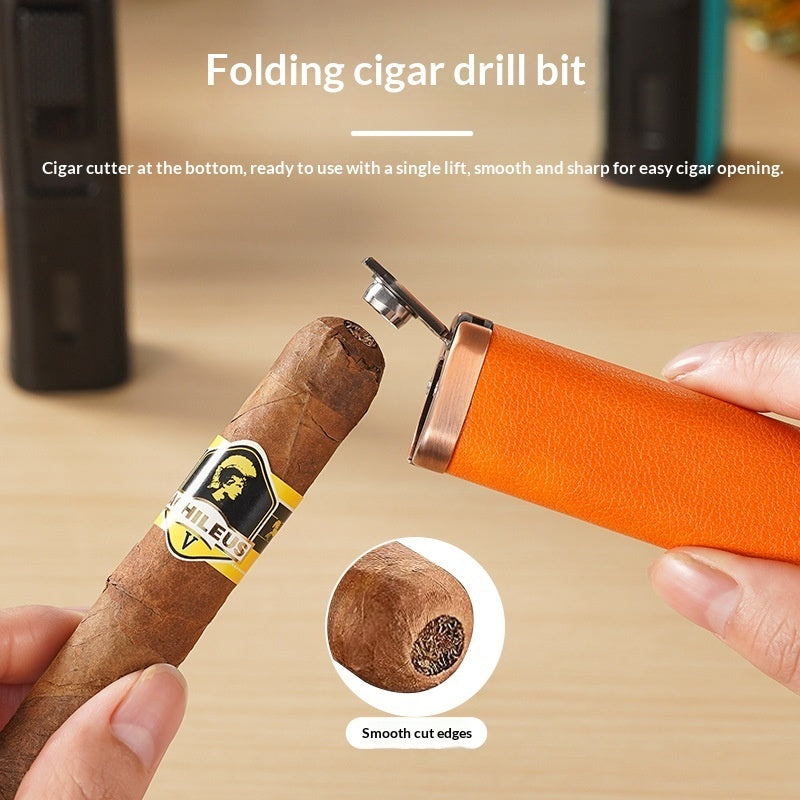 An orange folding cigar drill bit tool being used by a hand to open a cigar, with text explaining its function and a circular inset showing the smooth cut edge of the cigar.